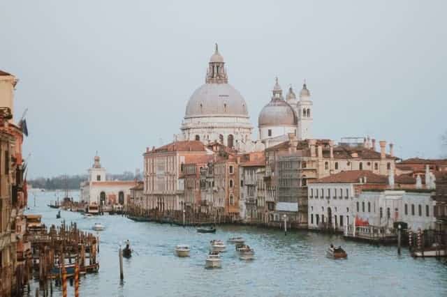 Venice city look beautiful with the boats floating around in river