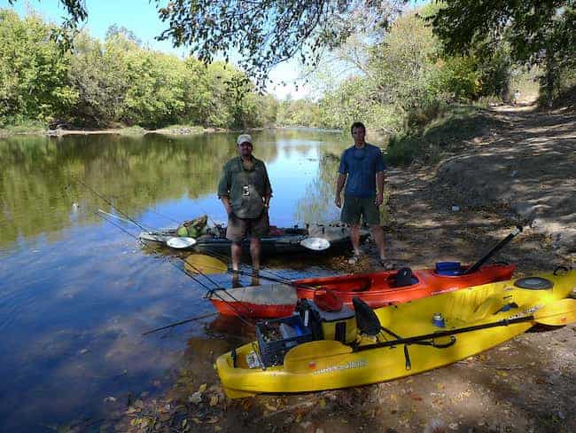 Two men are ready to start the kayak camping